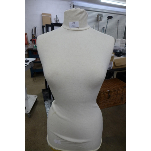 2230 - A dress makers mannequin on stand