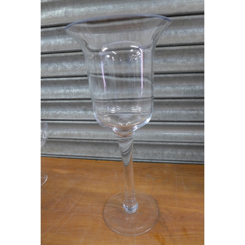 2259 - A large glass candle holder, small glass candle holder and a 25cm decorative glass jar