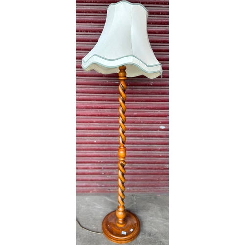 268 - An oak barleytwist standard lamp