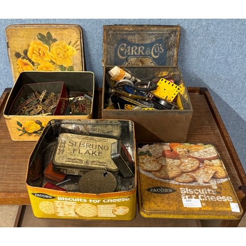 310 - Assorted vintage tins, containing assorted items including Meccano