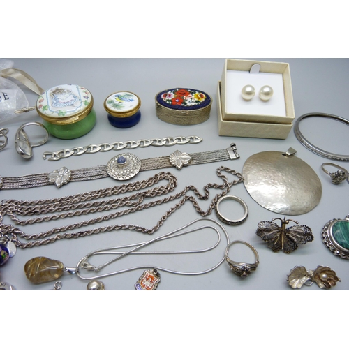 1007 - A collection of silver and white metal jewellery including a silver charm bracelet, chains, pendants... 