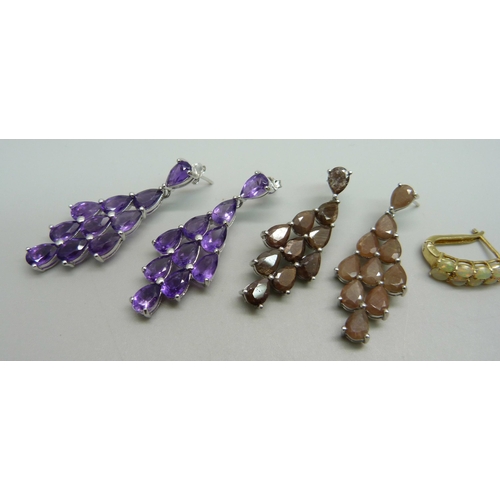 1010 - Three pairs of sterling silver earrings set with amethyst, Ethiopian opals and chocolate sapphires