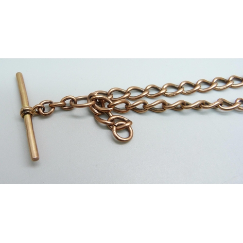 1029 - A 9ct rose gold double Albert chain with a yellow metal fob set with a purple stone, each link marke... 