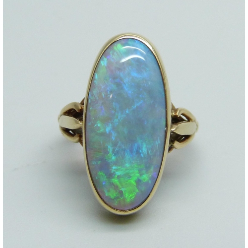 1033 - A black opal ring set in 9ct gold, 4.1g, opal 20mm x 0.9mm, ring size G