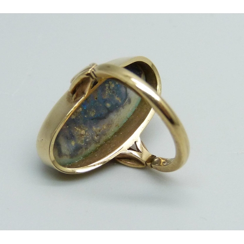 1033 - A black opal ring set in 9ct gold, 4.1g, opal 20mm x 0.9mm, ring size G