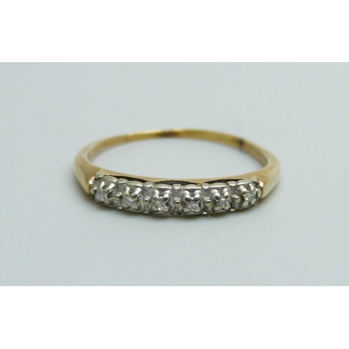 1034 - An 18ct gold ring set with six diamonds, 1.6g, N