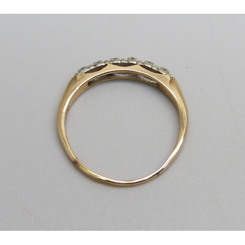 1034 - An 18ct gold ring set with six diamonds, 1.6g, N