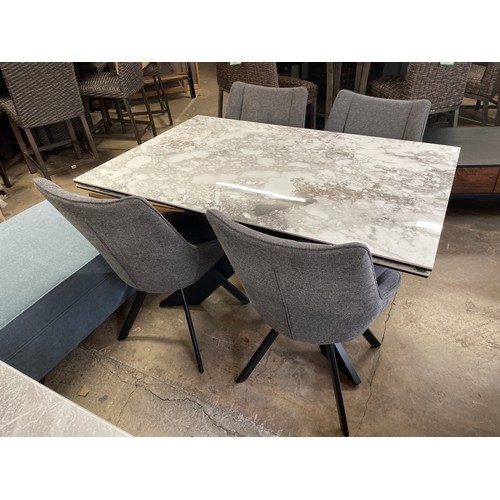1440 - A ceramic marble extending dining table and four grey swivel chairs  *This lot is subject to VAT