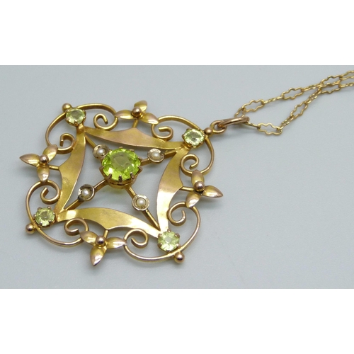 1050 - A 9ct gold pendant set with peridot and half seed pearls on a 9ct gold chain, 5.1g, 36cm