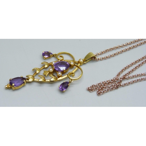 1053 - A 9ct gold amethyst and seed pearl pendant on a silver gilt chain, pendant 5.3g and 54mm