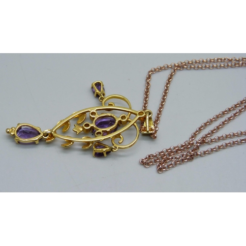 1053 - A 9ct gold amethyst and seed pearl pendant on a silver gilt chain, pendant 5.3g and 54mm