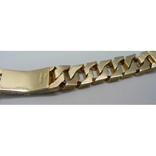 1058 - A heavy 9ct gold curb linked ID bracelet with bark effect texture, set with 3.4ct of diamonds, round... 