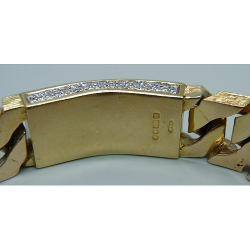 1058 - A heavy 9ct gold curb linked ID bracelet with bark effect texture, set with 3.4ct of diamonds, round... 