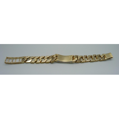 1058 - A heavy 9ct gold curb linked ID bracelet with bark effect texture, set with 3.4ct of diamonds, round... 