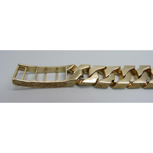 1058 - A heavy 9ct gold curb linked ID bracelet with bark effect texture, set with 3.4ct of diamonds, round... 