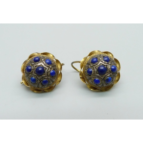 1067 - A pair of 18ct gold earrings set with lapis lazuli, 4.8g