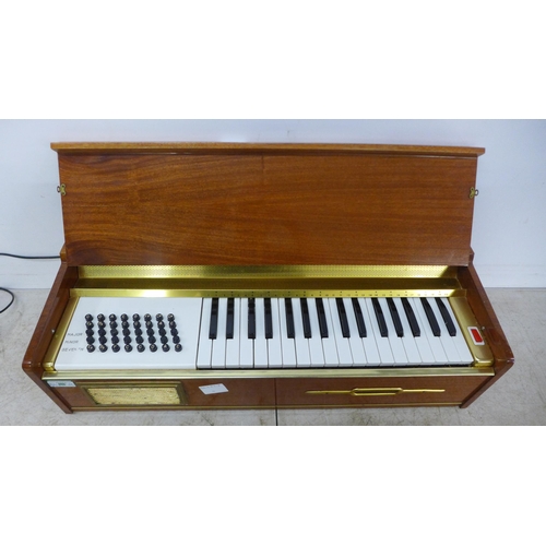 2111 - A J-Busilacchio electronic harmonium with legs