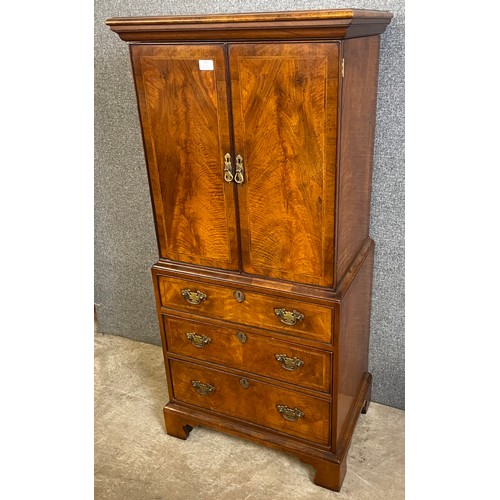 128 - A George I style walnut cupboard on chest