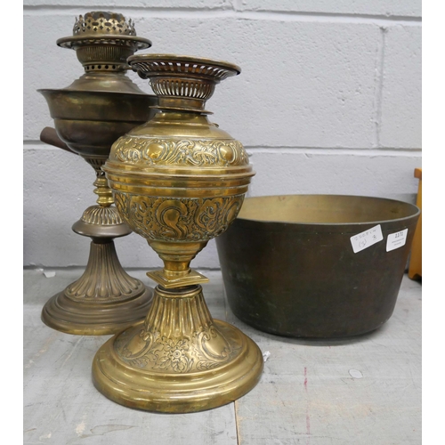 1171 - A heavy brass pan and two oil lamp bases **PLEASE NOTE THIS LOT IS NOT ELIGIBLE FOR IN-HOUSE POSTING... 