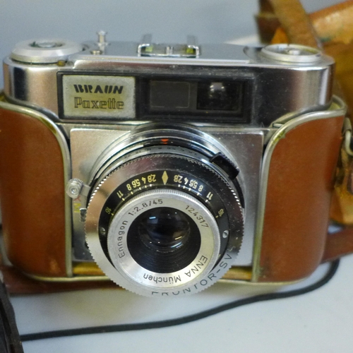 615 - A Brownie box camera, one other Paxette and a light meter