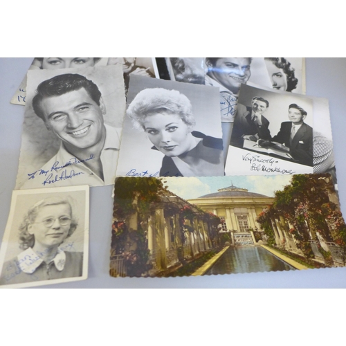 617 - A tin containing celebrity photographs and postcards, many with facsimile autographs including Dirk ... 