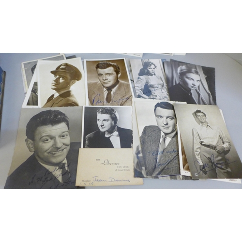 617 - A tin containing celebrity photographs and postcards, many with facsimile autographs including Dirk ... 