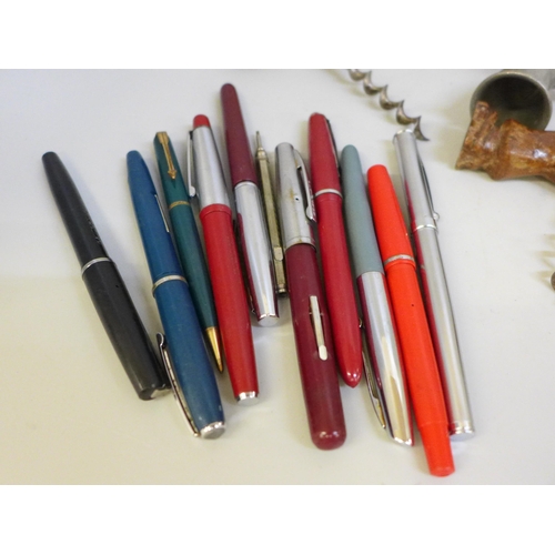 638 - A collection of pens including fountain pens, drinking related items including cork screws, alcohol ... 