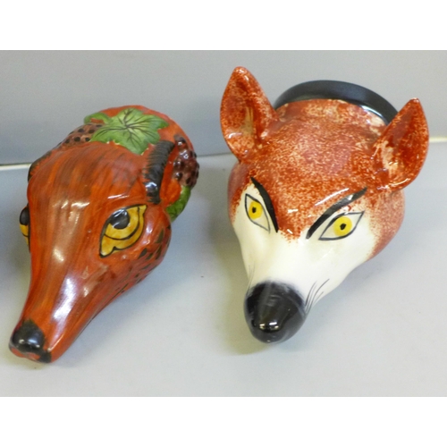646 - Four Staffordshire china fox heads in the shape of stirrup cups