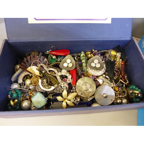 663 - A tray of costume jewellery and a box of earrings