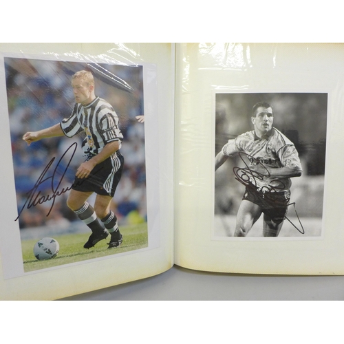 668 - An album of signed football photographs, Premier League and earlier playing legends, 40 in total, in... 