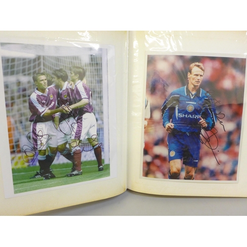 668 - An album of signed football photographs, Premier League and earlier playing legends, 40 in total, in... 