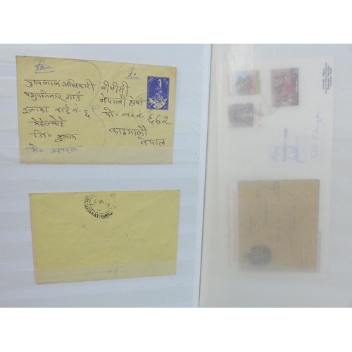 673 - Nepal stamps and postal history in album