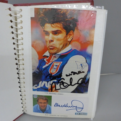 699 - An album with a collection of signed football pictures, all ex players, 148 in total includes Trevir... 