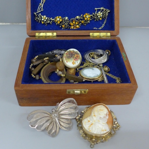 706 - A collection of costume jewellery, a white metal filigree butterfly brooch and a gold plated Victori... 