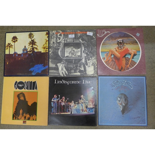 711 - A collection of LP records including The Eagles, Bonzo Dog Band, Lindisfarne live, 10CC, etc.