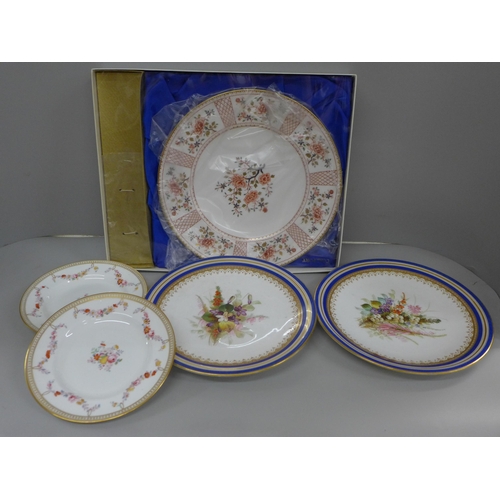 713 - Two Royal Worcester plates decorated with sprays of flowers, a Coalport cake plate, boxed and two ot... 