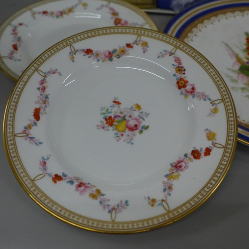 713 - Two Royal Worcester plates decorated with sprays of flowers, a Coalport cake plate, boxed and two ot... 