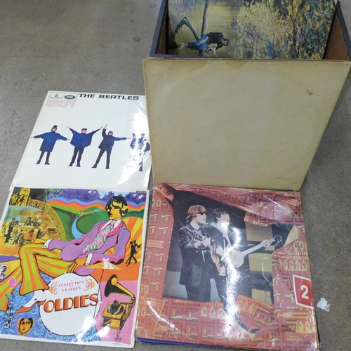 743 - Eighteen The Beatles and related LP records including numbered White Album, (top opening) and Help! ... 