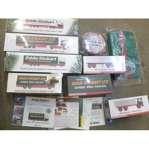 764 - A box of Eddie Stobart model vehicles and other related merchandise