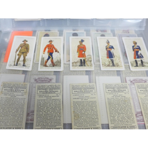 798A - An album of cigarette cards and tea cards, Military Uniforms; Regimental Uniforms; Arms & Armour, et... 