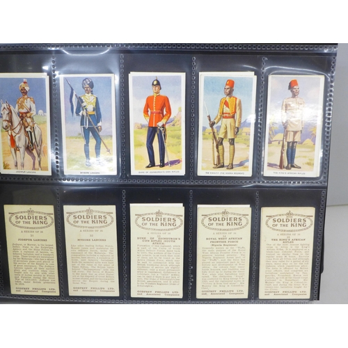 798A - An album of cigarette cards and tea cards, Military Uniforms; Regimental Uniforms; Arms & Armour, et... 