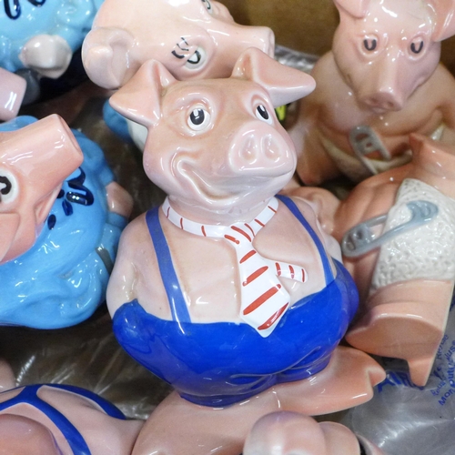 810 - A collection of Wade Nat West pigs, thirteen in total **PLEASE NOTE THIS LOT IS NOT ELIGIBLE FOR IN-... 