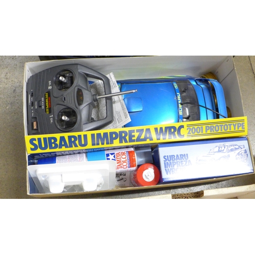 813 - A Tamiya Subaru Impreza WRC 1/10th scale radio control 4WD high performance rally car, boxed, car bo... 