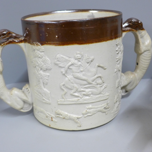 831 - A Denby Victorian saltglaze loving cup, two mugs and a jug - two with old staple repairs (4)