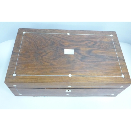 832 - A walnut and mother of pearl inlaid writing box, a/f