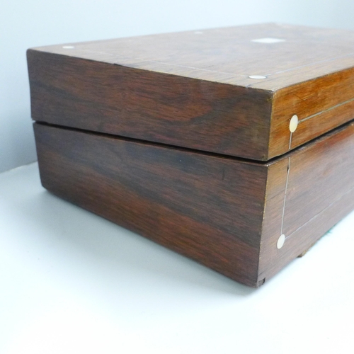 832 - A walnut and mother of pearl inlaid writing box, a/f