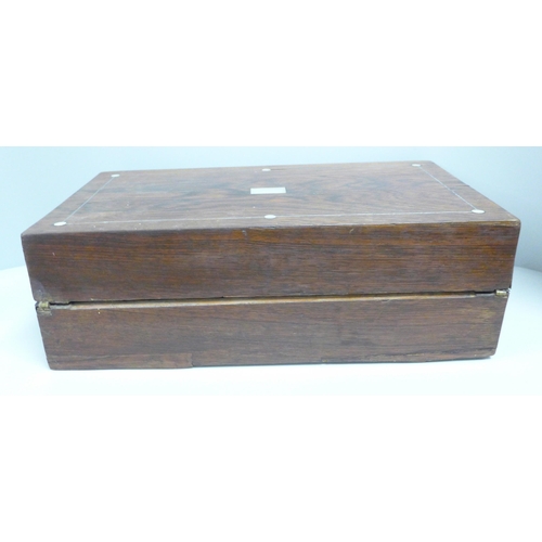 832 - A walnut and mother of pearl inlaid writing box, a/f