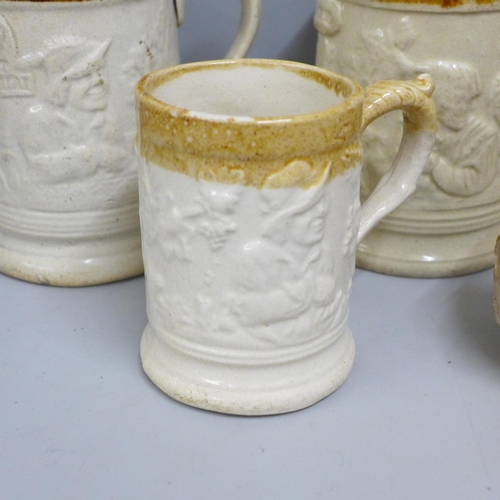 842 - Two Victorian saltglaze small jugs one with cherubs and three Imperial pint mugs and one ½ pint mug ... 