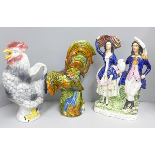 848 - A Staffordshire flat back figure, a cockerel jug and a majolica cockerel