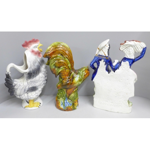 848 - A Staffordshire flat back figure, a cockerel jug and a majolica cockerel